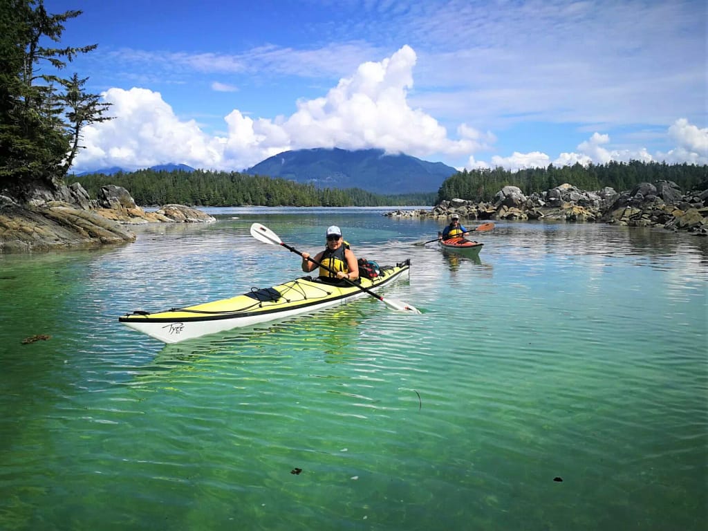 kayakers having fun on the see kayaking adventure - Broken Group Islands BC
