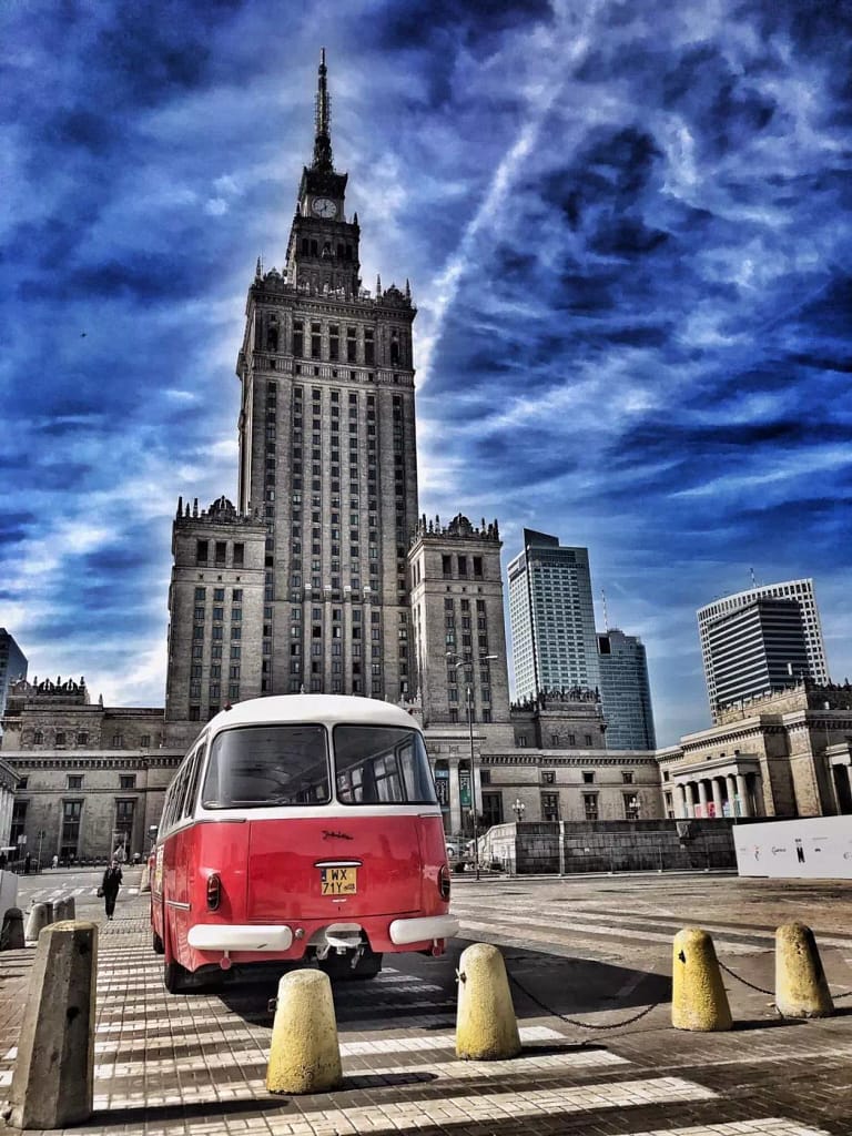 photo with a vintage van in front of a building on the Poland photography tour