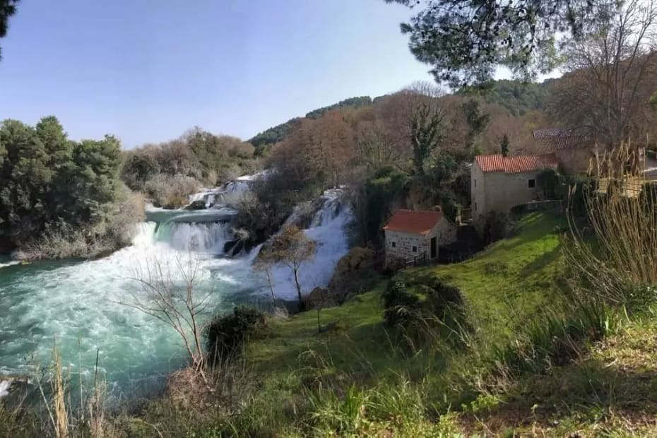 Image of Croatian river flowing next to a village
